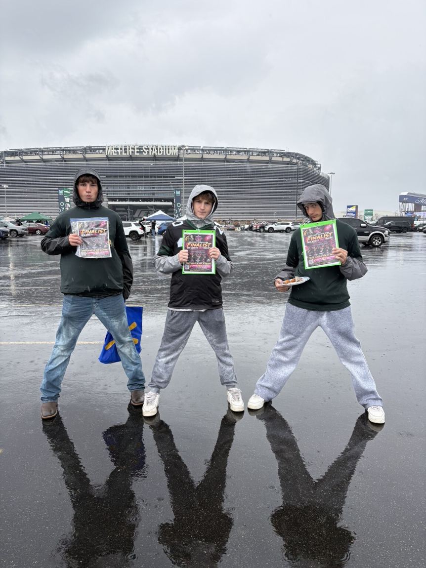 Mustangs supporters sharing finalist flyers outside MetLife Stadium