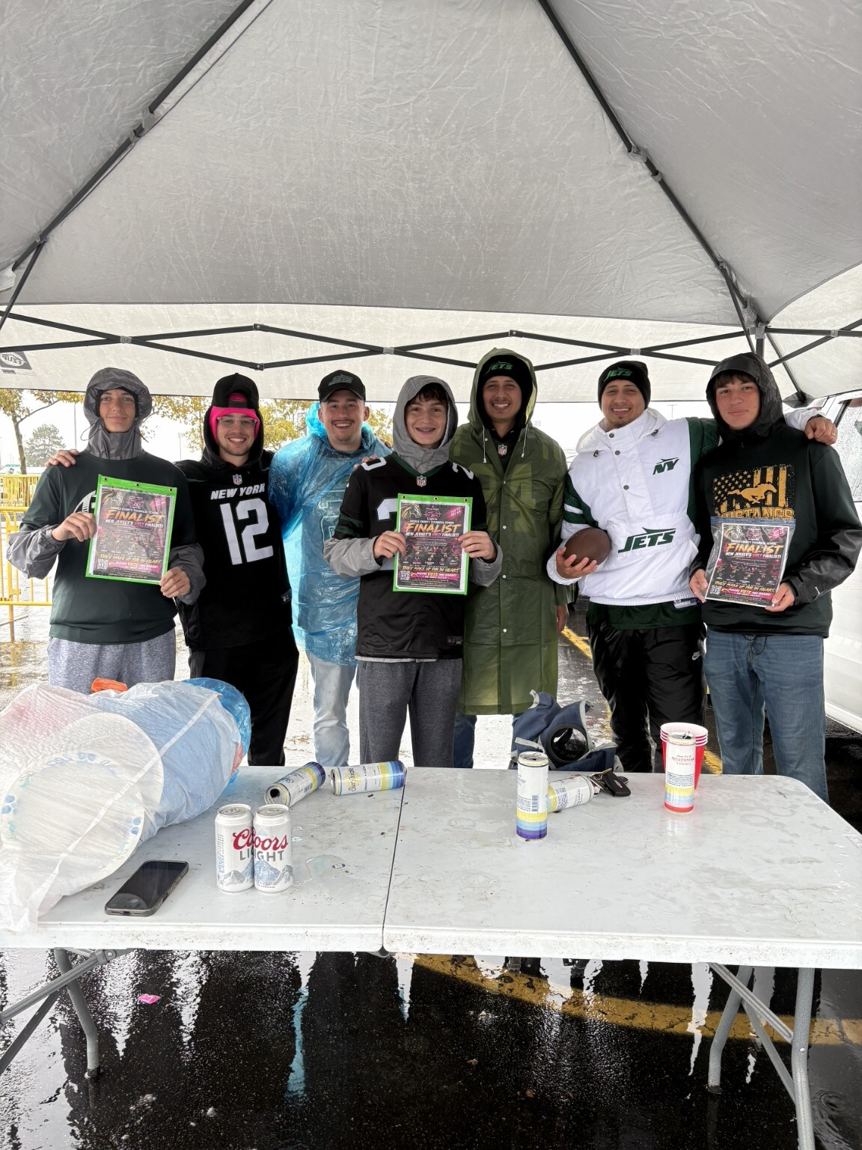 Supporters sharing voting flyers under a Jets canopy